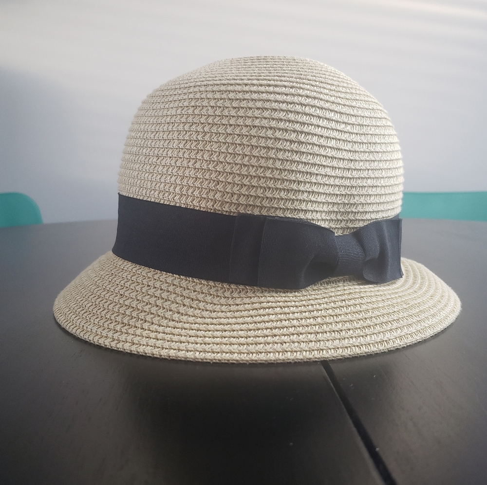 Tan hat with black bow